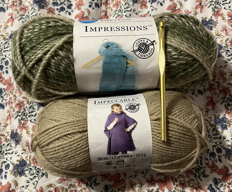 new skeins of yarn in green and beige.