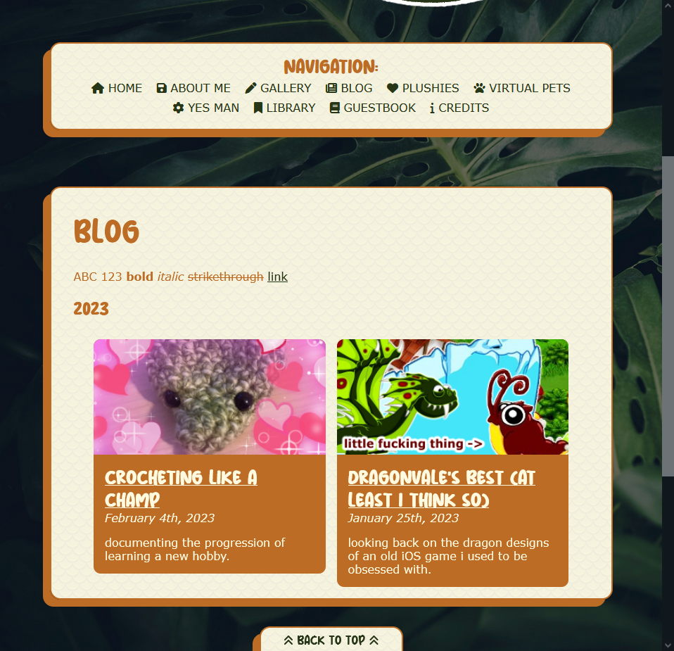 a screenshot of the blog page of wyrmtunnel, with a dark green, leafy background and cream-colored content boxes. it has a navigation bar on the top and a large main body section displaying two blog entry links: "crocheting like a champ" and "dragonvale's best (at least i think so)."