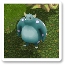 a stout, blue monster with small horns and lilac spots. it has short legs and beady eyes.